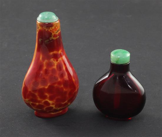 Two Chinese glass snuff bottles, 18th / 19th century, 4.1cm, the latter with jadeite stopper